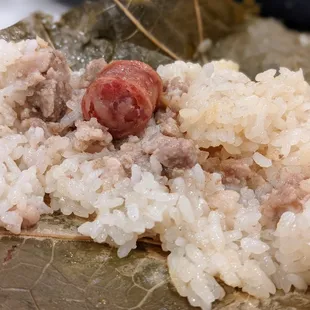 Lo mai gai. Sticky chicken rice in lotus leaf. Dim sum pricing as of August 2021: Small dish $4.09, medium dish $4.99, large dish $5.99.