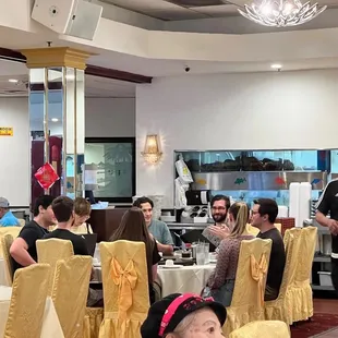 a group of people sitting at tables