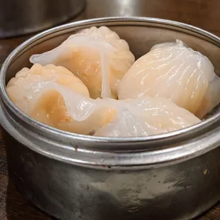 Shrimp har gow. Dim sum pricing as of August 2021: Small dish $4.09, medium dish $4.99, large dish $5.99.