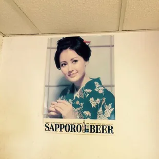 A classic Sapporo beer sign, part of the familiar decorations here for years.