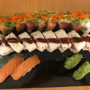 a plate of sushi and rolls