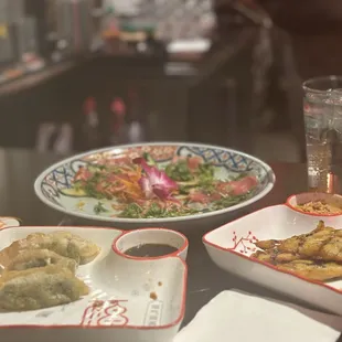 Tuna tataki (back), veggie dumplings (left), chicken satay (right)