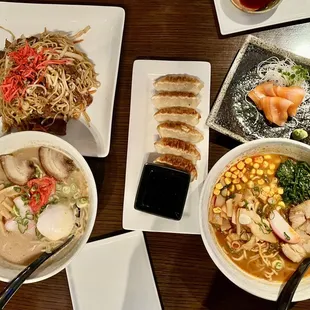 food spread!! spicy miso ramen, tonkotsu ramen, gyoza, beef yakisoba, and salmon sashimi
