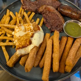 Parilla Origen - Smoked meat, chorizo, yuca fries, fries and a house salad