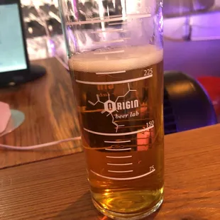 a glass of beer on a table