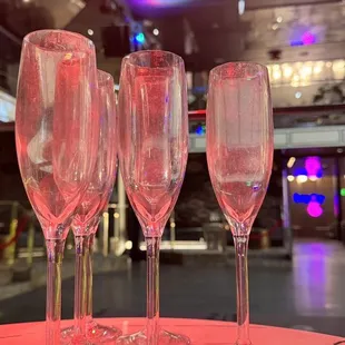 three empty wine glasses on a table