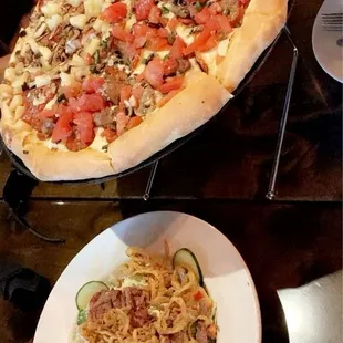 Pizza with steak salad