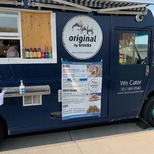 a food truck parked on the side of the road