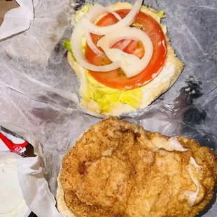 a fried chicken sandwich with a side of mayonnaise
