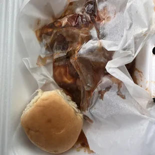 a close up of a sandwich in a styrofoam container