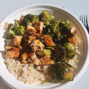 a bowl of rice and broccoli