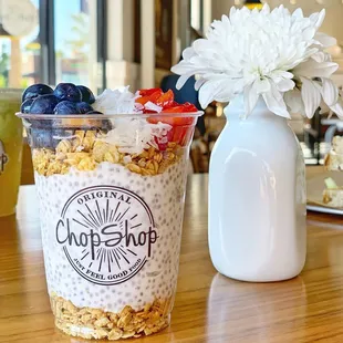 a yogurt cup with fruit and granola