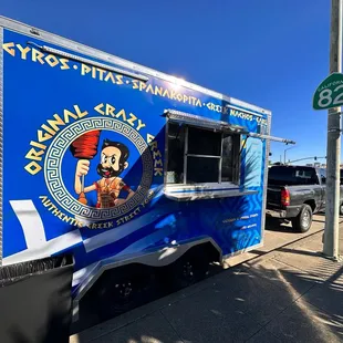 a food truck parked on the side of the road