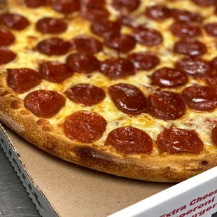 a pepperoni pizza in a box