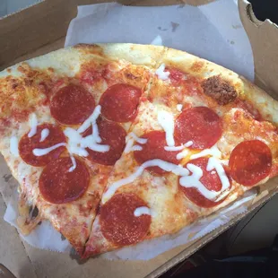 a slice of pepperoni pizza
