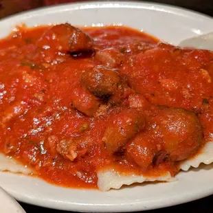 a plate of pasta and meatballs