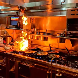 a man cooking in a commercial kitchen