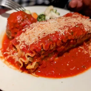 Lasagna and a meatball.