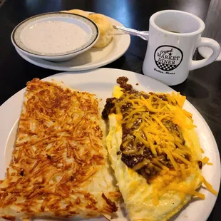 Chili cheese omelet hashbriwns and biscuits and gravy