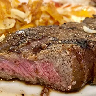 6 oz NY steak,  2 eggs, hash browns  and with toast