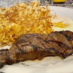 6 oz NY steak,  2 eggs, hash browns  and with toast