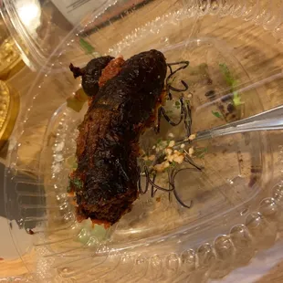 a piece of meat in a plastic container
