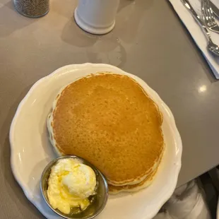 a pancake with butter and syrup