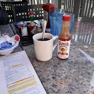 Small coffee cup. Hot sauce is there for scale.