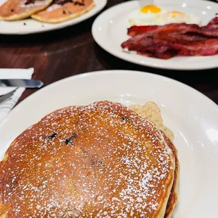 a pancake with bacon and eggs