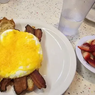 Croissant sandwich and side of fruit