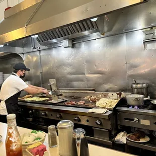 a chef preparing food in the kitchen
