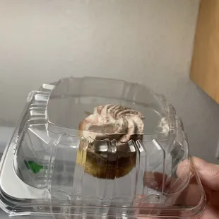 a cupcake in a plastic container