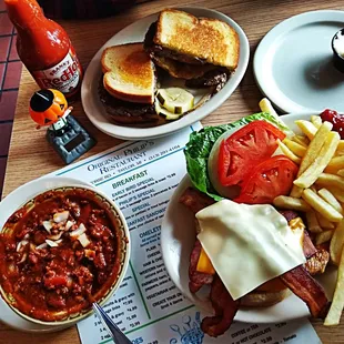 a burger, fries, and tomato sauce