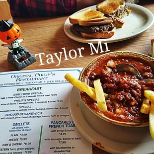 a bowl of chili and a sandwich