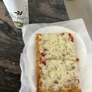 two slices of pizza and a drink