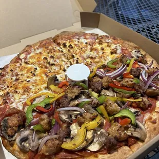Half cheese and combo pizza.