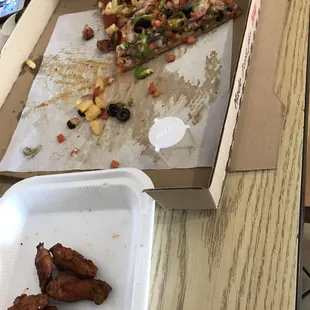Veggies and hot Mexican delight pizza and wings. So yummy!