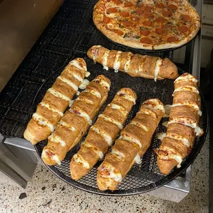 a variety of breadsticks and pizzas