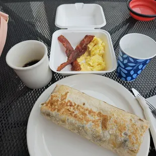 Breakfast Burrito, Side of two Eggs with bacon, and coffee.
