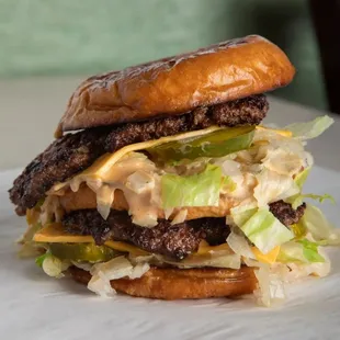 a hamburger with lettuce and cheese