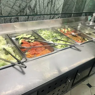 a variety of salads in a buffet