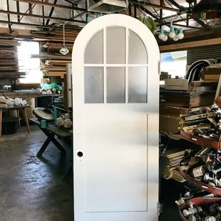 Salvaged arch door in Originate's salvage yard | Tucson, AZ