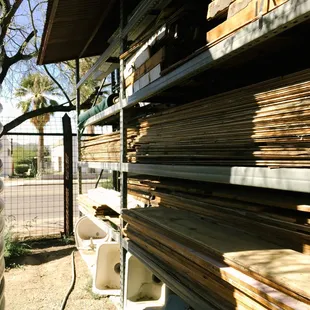 Originate natural building's salvage yard featuring salvaged wood and salvaged sinks | Tucson, AZ