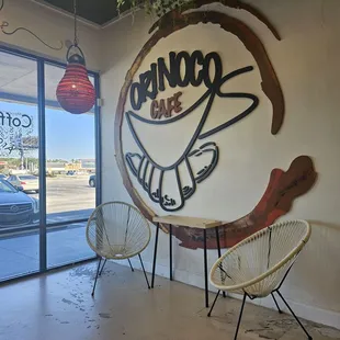 two chairs in front of a coffee shop