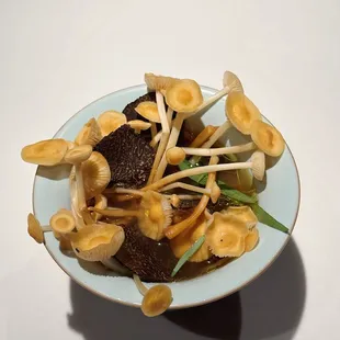 Golden enoki with truffle custard, foie gras, chicken broth IG: eatwithtako