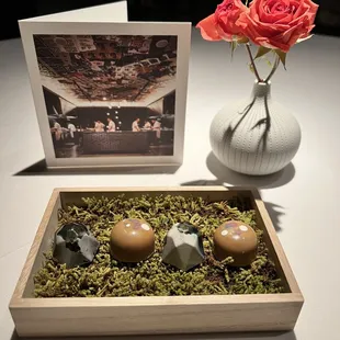 Mignardises: Toasted yeast / coconut-herb bon bons