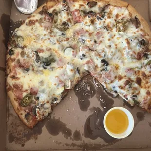 a half eaten pizza in a box