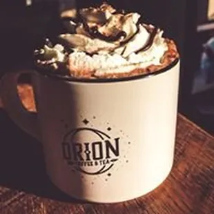 a cup of coffee with whipped cream