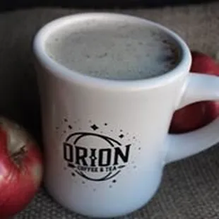 a cup of coffee and an apple