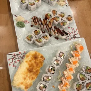 a variety of sushi on plates